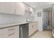 Bright updated kitchen boasts stainless steel appliances, sleek cabinets, and modern countertops at 8921 Blind Pass Rd # 142, St Pete Beach, FL 33706