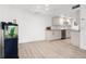 Cozy living space with adjacent kitchen boasting sleek cabinetry and modern finishes at 8921 Blind Pass Rd # 142, St Pete Beach, FL 33706