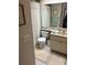 Functional bathroom with tub/shower, neutral tile, and sink vanity offers practical comfort at 9302 Trowbridge Ct, New Port Richey, FL 34655