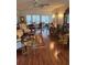 Spacious living room featuring sophisticated decor, natural light, and hardwood floors at 9302 Trowbridge Ct, New Port Richey, FL 34655