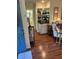 Inviting living room with display cabinet, and hardwood floors at 9302 Trowbridge Ct, New Port Richey, FL 34655