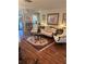 Inviting living room features elegant furniture, decorative accents, and a patterned rug over hardwood floors at 9302 Trowbridge Ct, New Port Richey, FL 34655