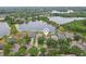 Aerial view of the neighborhood and lake, perfect for nature lovers at 9329 Huntington Park Way, Tampa, FL 33647