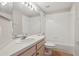 Bathroom with toilet, vanity, mirror, and shower-tub combo at 9329 Huntington Park Way, Tampa, FL 33647