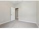 Neutral bedroom with carpet and an open door at 9329 Huntington Park Way, Tampa, FL 33647