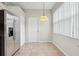 Eat-in kitchen area features stainless steel refrigerator and large window at 9329 Huntington Park Way, Tampa, FL 33647