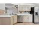 Open concept kitchen area with stainless steel appliances and tile flooring at 9329 Huntington Park Way, Tampa, FL 33647