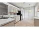 Bright kitchen features stainless steel appliances and tile flooring at 9329 Huntington Park Way, Tampa, FL 33647