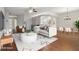 A spacious living room with hardwood floors and lots of natural light, virtually staged with modern furniture at 9329 Huntington Park Way, Tampa, FL 33647