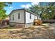 Backyard exterior with a wooden deck, great for outdoor living at 9690 Jerome Dr, New Port Richey, FL 34654