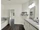 Bright bathroom with double vanity, granite countertops, and stylish fixtures at 9690 Jerome Dr, New Port Richey, FL 34654
