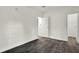 Bedroom featuring sleek flooring, ample natural light, and easy access to the closet at 9690 Jerome Dr, New Port Richey, FL 34654
