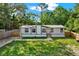 Charming single-story home with well-maintained lawn and natural surroundings providing a serene and private setting at 9690 Jerome Dr, New Port Richey, FL 34654