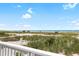 Scenic beach view from a deck, showcasing the white sand and ocean at 9760 Little Gasparilla Island, Placida, FL 33946