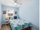 Light and airy bedroom with coastal decor, a comfortable bed, and serene blue walls at 9760 Little Gasparilla Island, Placida, FL 33946