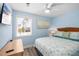 Cozy bedroom with a queen-sized bed, coastal-themed decor, and ample natural light from the window at 9760 Little Gasparilla Island, Placida, FL 33946