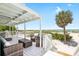 Spacious outdoor deck with comfortable seating and stunning views of the beach and ocean at 9760 Little Gasparilla Island, Placida, FL 33946