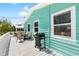 Outdoor patio featuring dining seating and a grill, great for seaside entertaining at 9760 Little Gasparilla Island, Placida, FL 33946