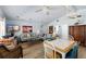 Bright living room with coastal decor, comfortable seating, and an adjacent dining area at 9760 Little Gasparilla Island, Placida, FL 33946