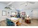 Coastal living room with ocean views, a dining area, comfortable seating, and charming decor at 9760 Little Gasparilla Island, Placida, FL 33946