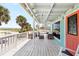 Inviting outdoor porch area with comfortable seating, perfect for enjoying ocean views at 9760 Little Gasparilla Island, Placida, FL 33946
