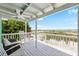 Charming porch offers stunning beach views and comfortable seating, perfect for relaxation at 9760 Little Gasparilla Island, Placida, FL 33946