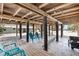 Open space under home with seating and ample room for beachside enjoyment at 9760 Little Gasparilla Island, Placida, FL 33946