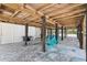 Spacious covered area underneath the elevated house, ideal for storage and activities at 9760 Little Gasparilla Island, Placida, FL 33946