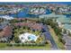 Waterfront condo community featuring a pool, assigned parking, and lush landscaping at 1028 Apollo Beach Blvd # 21, Apollo Beach, FL 33572