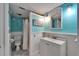 Cozy bathroom with nautical decor featuring shower, vanity, toilet, and decorative lighting at 1028 Apollo Beach Blvd # 21, Apollo Beach, FL 33572