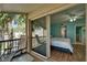 Bright bedroom with ceiling fan, closet, and access to private balcony with seating at 1028 Apollo Beach Blvd # 21, Apollo Beach, FL 33572