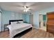 Bright bedroom with ceiling fan, closet, and ensuite bathroom with nautical theme at 1028 Apollo Beach Blvd # 21, Apollo Beach, FL 33572