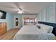 Bright bedroom with ceiling fan, closet, access to private balcony, and ensuite bathroom at 1028 Apollo Beach Blvd # 21, Apollo Beach, FL 33572