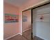 Bedroom closet with mirrored sliding doors and built-in shelving for organized storage at 1028 Apollo Beach Blvd # 21, Apollo Beach, FL 33572