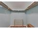 Walk-in closet featuring wire shelving and a shoe rack for ample storage solutions at 1028 Apollo Beach Blvd # 21, Apollo Beach, FL 33572