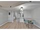 Dining area with laminate flooring, modern lighting, and an open floor plan at 1028 Apollo Beach Blvd # 21, Apollo Beach, FL 33572