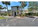 Home exterior with colorful siding, well-maintained landscaping, ample parking, and a welcoming entryway at 1028 Apollo Beach Blvd # 21, Apollo Beach, FL 33572