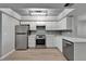 Updated kitchen with stainless steel appliances and modern white cabinetry at 1028 Apollo Beach Blvd # 21, Apollo Beach, FL 33572