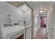 Laundry room with washer and dryer, shelving, and access to the hallway with a bedroom at 1028 Apollo Beach Blvd # 21, Apollo Beach, FL 33572