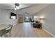 Bright living room with sliding glass doors, gray sofa, and ceiling fan at 1028 Apollo Beach Blvd # 21, Apollo Beach, FL 33572