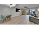Open-concept living area with modern decor, access to a screened lanai, and laminate flooring at 1028 Apollo Beach Blvd # 21, Apollo Beach, FL 33572