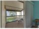Enjoy water views from this inviting screened patio with a table and chairs at 1028 Apollo Beach Blvd # 21, Apollo Beach, FL 33572