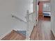 View of staircase with white banister and decorative stair runner leading to the home's second level at 1028 Apollo Beach Blvd # 21, Apollo Beach, FL 33572