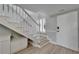Entryway featuring staircase with decorative white banister and convenient built-in storage at 1028 Apollo Beach Blvd # 21, Apollo Beach, FL 33572