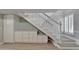 Elegant staircase with custom cabinetry for extra storage at 1028 Apollo Beach Blvd # 21, Apollo Beach, FL 33572