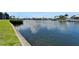 A serene waterfront view of boats docked along the canal and beautiful reflections on the calm water at 1028 Apollo Beach Blvd # 21, Apollo Beach, FL 33572