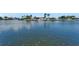 Waterfront view with a boat docked, showcasing the scenic location of the property at 1028 Apollo Beach Blvd # 21, Apollo Beach, FL 33572
