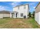 Exterior elevation shows a two-story home with covered back porch and fenced backyard at 1107 Seminole Sky Dr, Ruskin, FL 33570