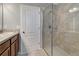 Bright bathroom featuring tile floors and a glass-enclosed shower at 1107 Seminole Sky Dr, Ruskin, FL 33570