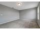 A well-lit bedroom with neutral walls and carpeting, ready for personalization at 1107 Seminole Sky Dr, Ruskin, FL 33570